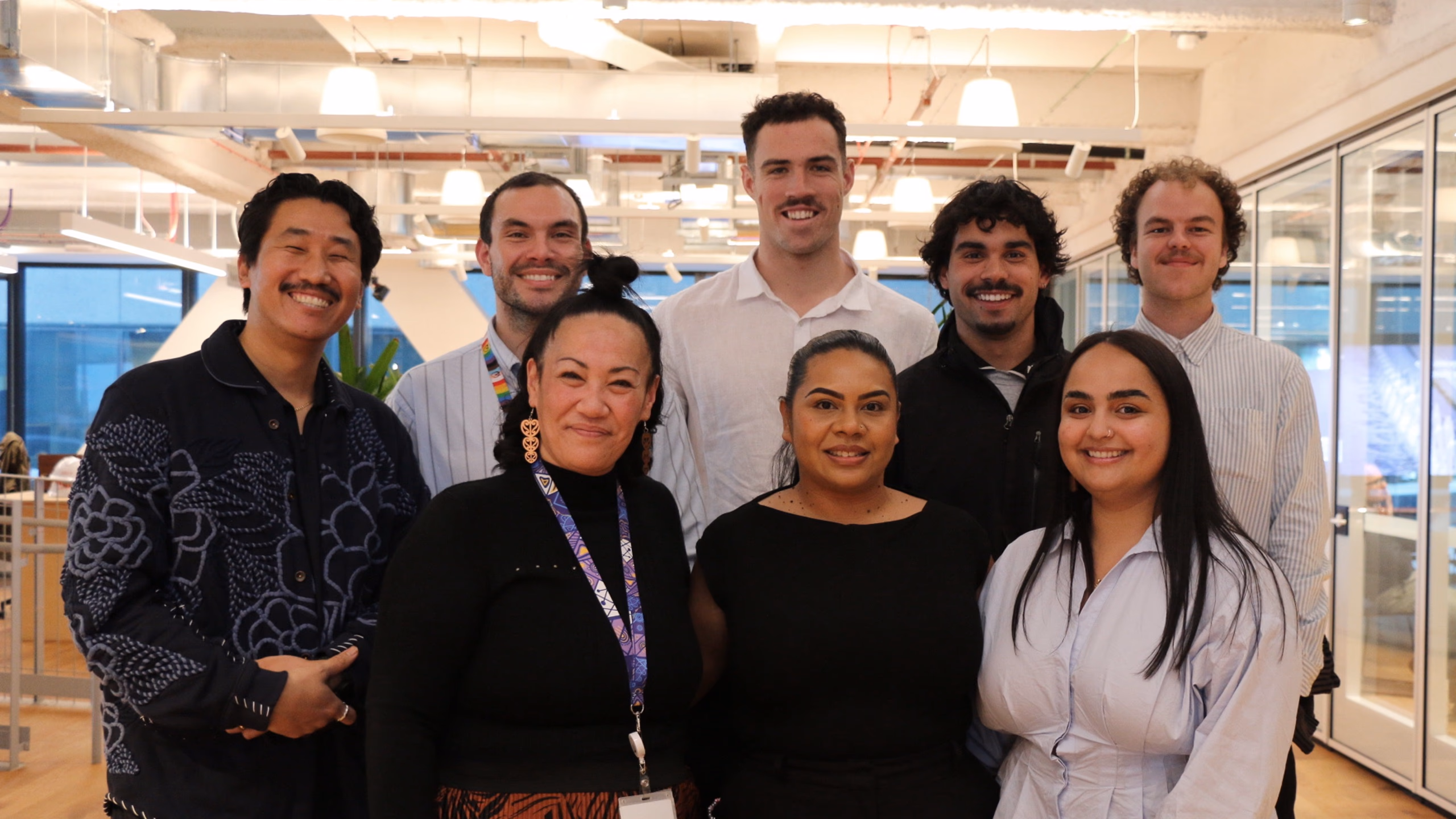 The CareerTrackers team smiling together in the office.