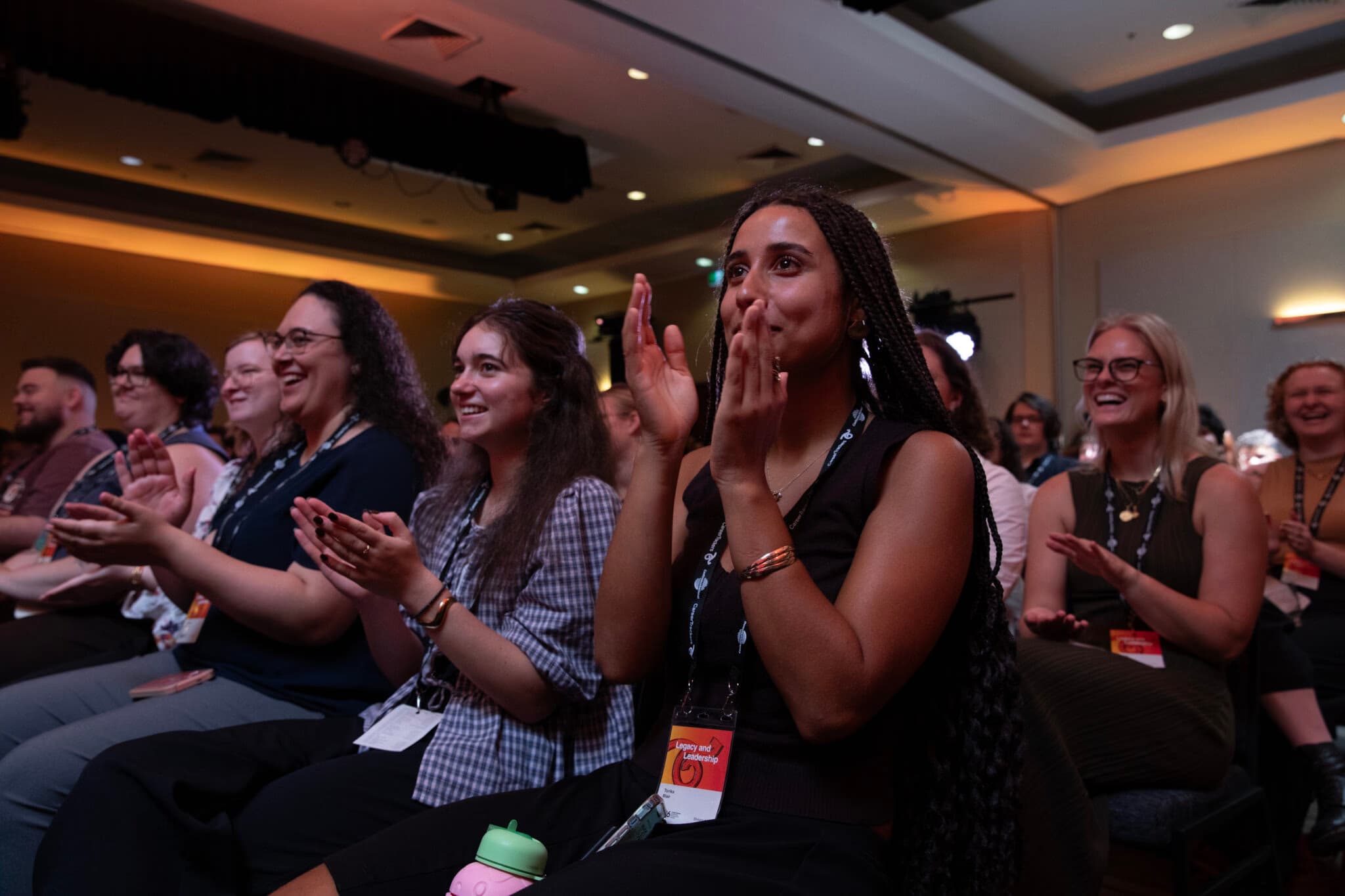 CareerTrackers students applauding in the audience at the 2026 Leadership Development Institute conference.