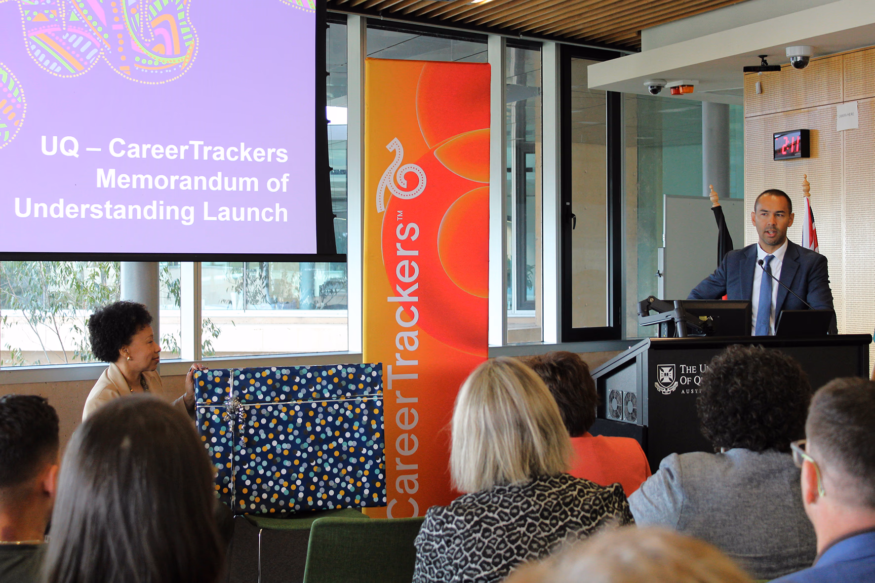 Representatives from the University of Queensland and CareerTrackers at the MOU signing panel presentation
