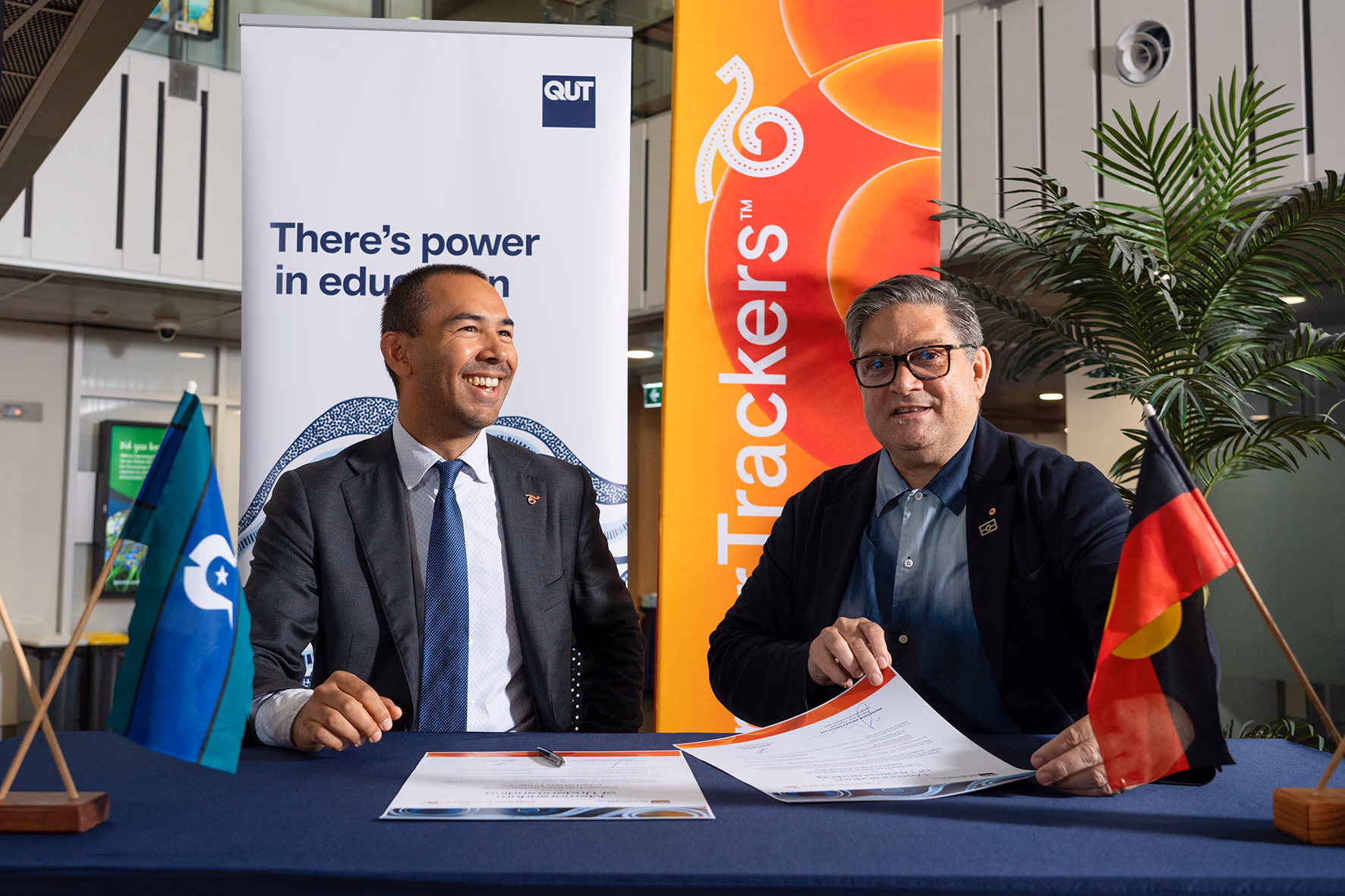 CareerTrackers CEO Adam Davids and QUT Deputy Vice-Chancellor Indigenous Australians, Professor Wesley Enoch, at a university partnership signing.